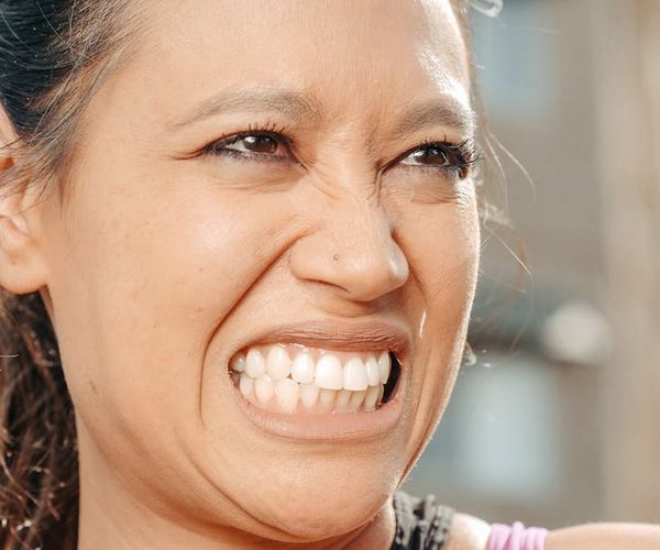 Woman feeling energetic and happy outdoors.